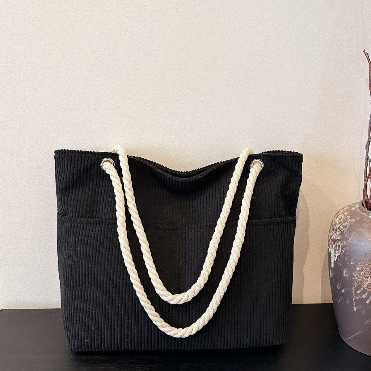 The new corduroy single-shoulder bag for women in winter 2024 is a solid color, simple and casual handbag with a light luxury and large capacity details Picture