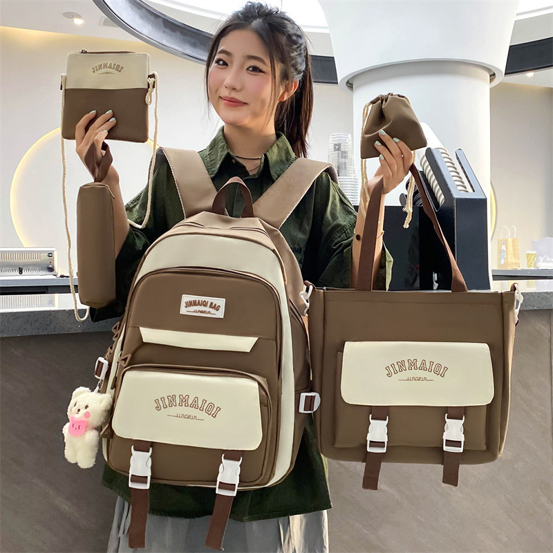 A five-piece Korean-style large-capacity schoolbag for girls in junior high school, a versatile casual backpack for protecting the spine, and a trendy backpack for girls with high appearance standards full figure