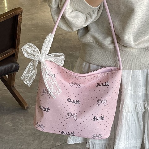 A niche design polka dot canvas bag for women, a new summer single-shoulder bag in 2025, is a super popular casual bucket bag details Picture