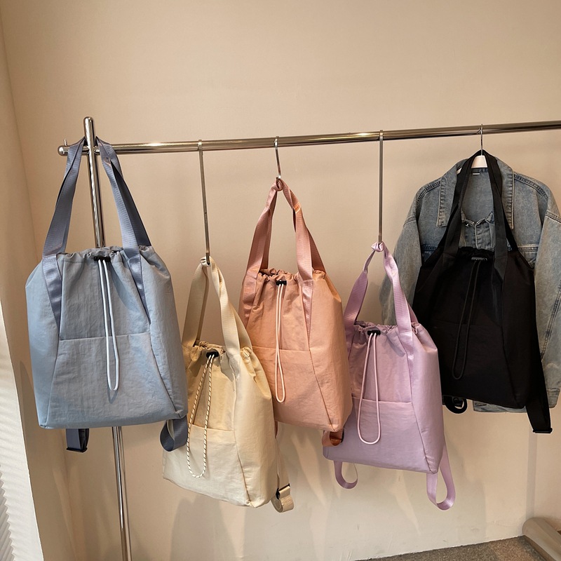 A new large-capacity, versatile Japanese solid-color, simple commuter backpack for women, multi-purpose drawstring handbag Application Scenario