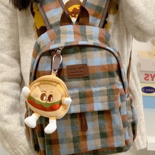 The new autumn and winter fashion check pattern large-capacity backpack is cute and versatile for student girls. It's a backpack for students to go to class Application Scenario