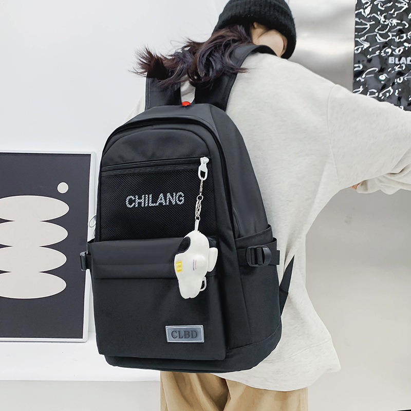 New casual schoolbag for junior high school, senior high school and primary school students, astronaut pendant, Korean version large-capacity backpack, travel backpack details Picture