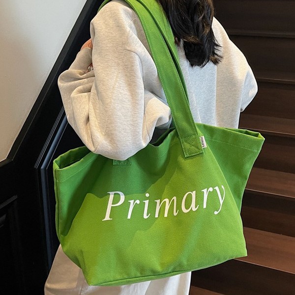 New cross-border large-capacity canvas bag for women 2025, new candy-colored casual letter-printed single-shoulder tote bag Application Scenario