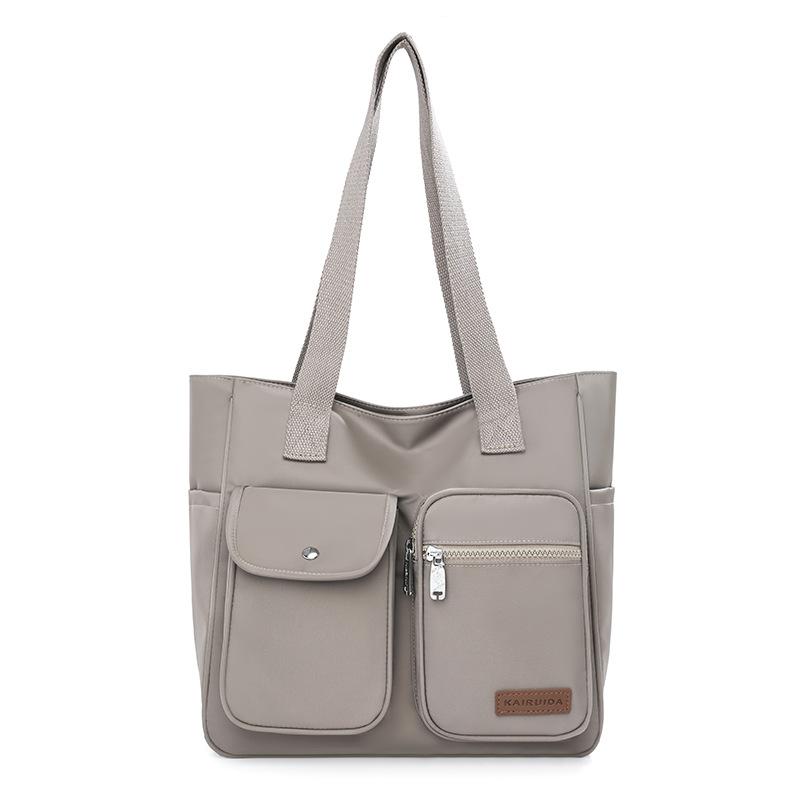 This is a new, simple and fashionable handbag for women. It is a large-capacity, trendy and high-quality nylon multi-layered single-shoulder bag Item Picture