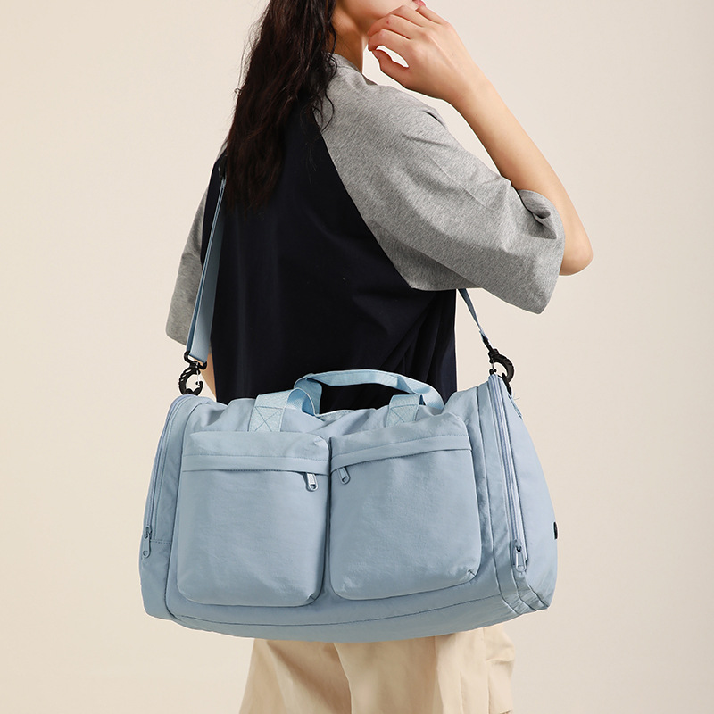 Water-resistant nylon fitness bag, solid color, simple, multi-pocket, foldable luggage bag, dry and wet separation travel bag Application Scenario