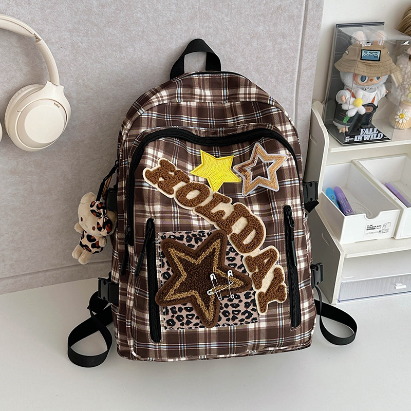 A new Japanese-style backpack for girls with a checkered pattern, suitable for children and middle school students. It is a niche but highly attractive backpack for traveling and attending classes details Picture