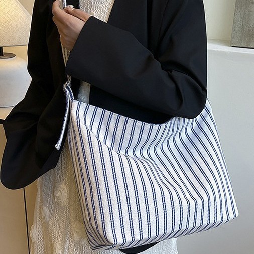 A fresh and elegant outdoor casual bag with a large capacity, multi-color vertical stripes, light and simple underarm single-shoulder bag and women's tote bag full figure