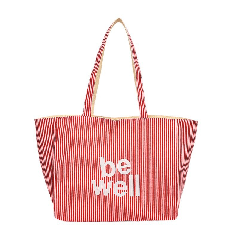 A new large-capacity tote double-sided striped casual single-shoulder textured lettered canvas bag for student commuting from South Korea Item Picture