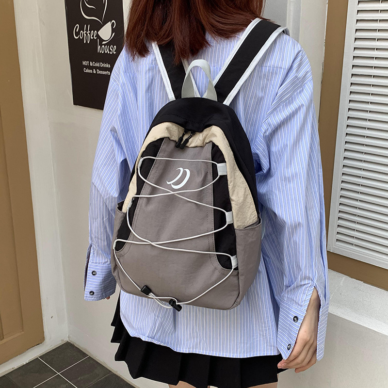 Cross-border solid-color backpacks, outdoor travel backpacks, sports small bags, new lightweight and large-capacity schoolbags Application Scenario