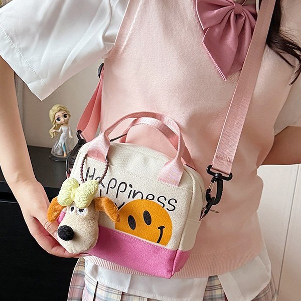 A cute smiling girl handbag carried out by hand, with a high level of appearance. A canvas bag with Korean-style prints and a trendy single-shoulder crossbody bag Specification drawing