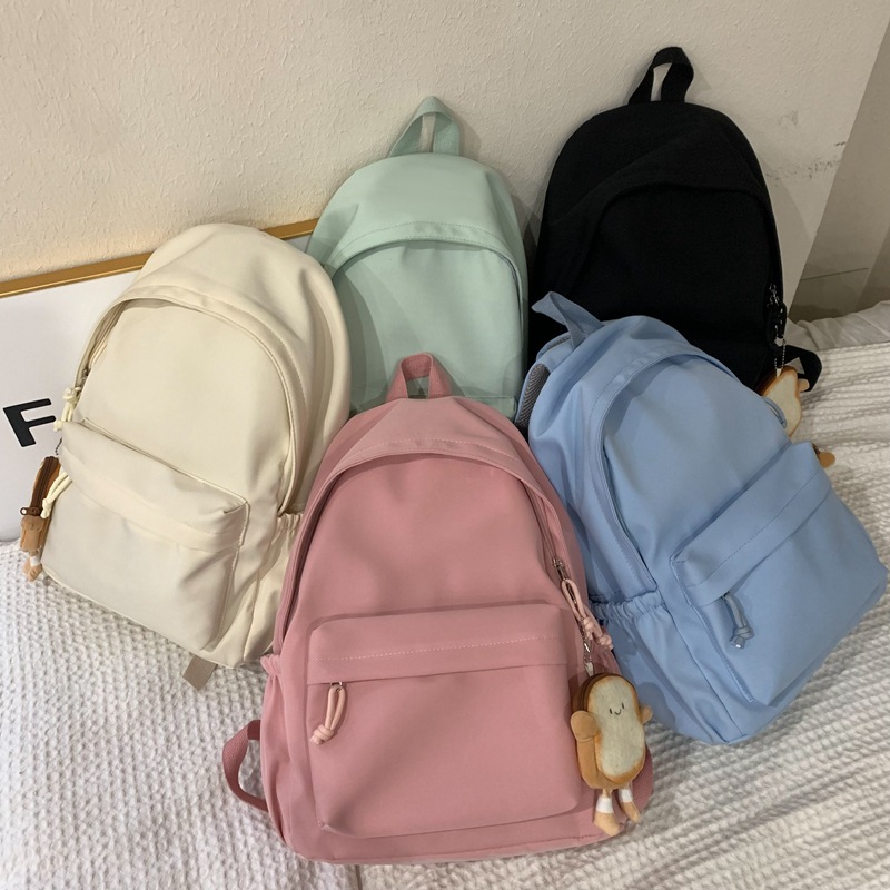 Cross-border Japanese-style campus casual solid-color schoolbag, simple large-capacity lightweight backpack, junior high school and primary school students' backpack full figure