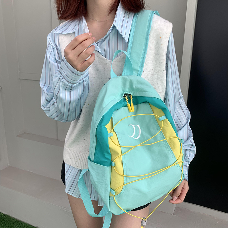 Cross-border solid-color backpacks, outdoor travel backpacks, sports small bags, new lightweight and large-capacity schoolbags full figure