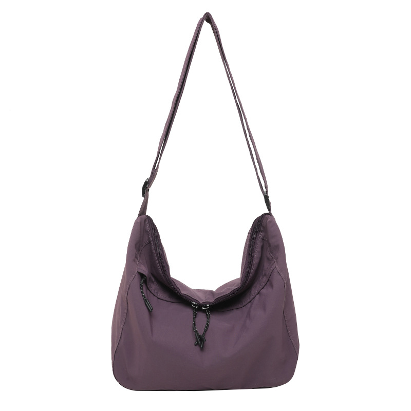 A new 2025 Korean version single-shoulder crossbody bag with large capacity for women, a casual and simple solid-color women's bag, and a tote bag for classes Item Picture