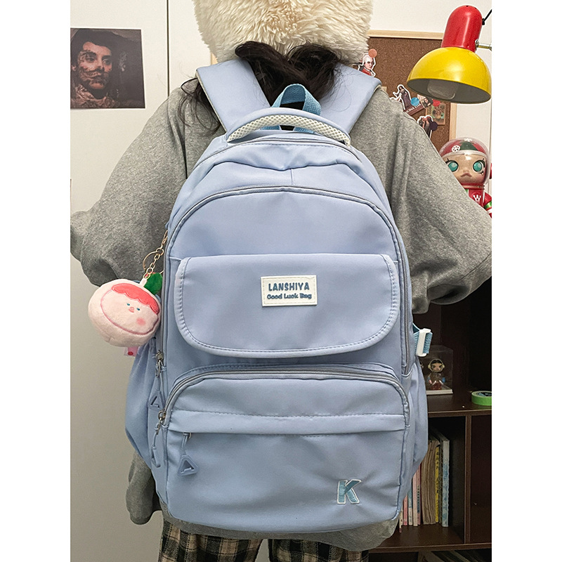 The new casual backpack is versatile for both male and female high school and college students. It is a large-capacity, fashionable, solid-color backpack in Korean style full figure