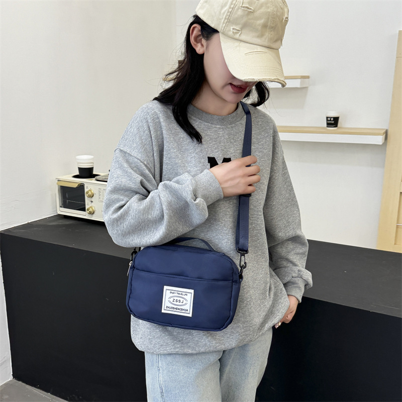 Wholesale of lightweight dry and wet separation single-shoulder bags for washing, Oxford cloth simple crossbody bags, portable small square bags for business trips details Picture