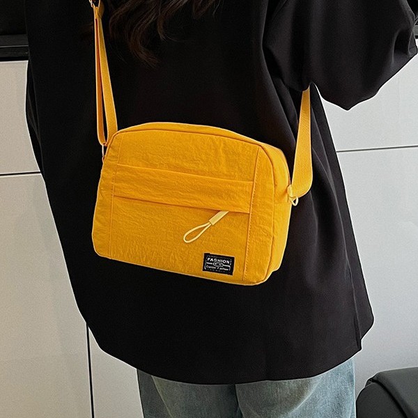 A versatile nylon fabric bag for cross-border use between Japan and South Korea, a solid color multi-functional single-shoulder bag for commuting and work, a cosmetic bag, and a crossbody bag details Picture