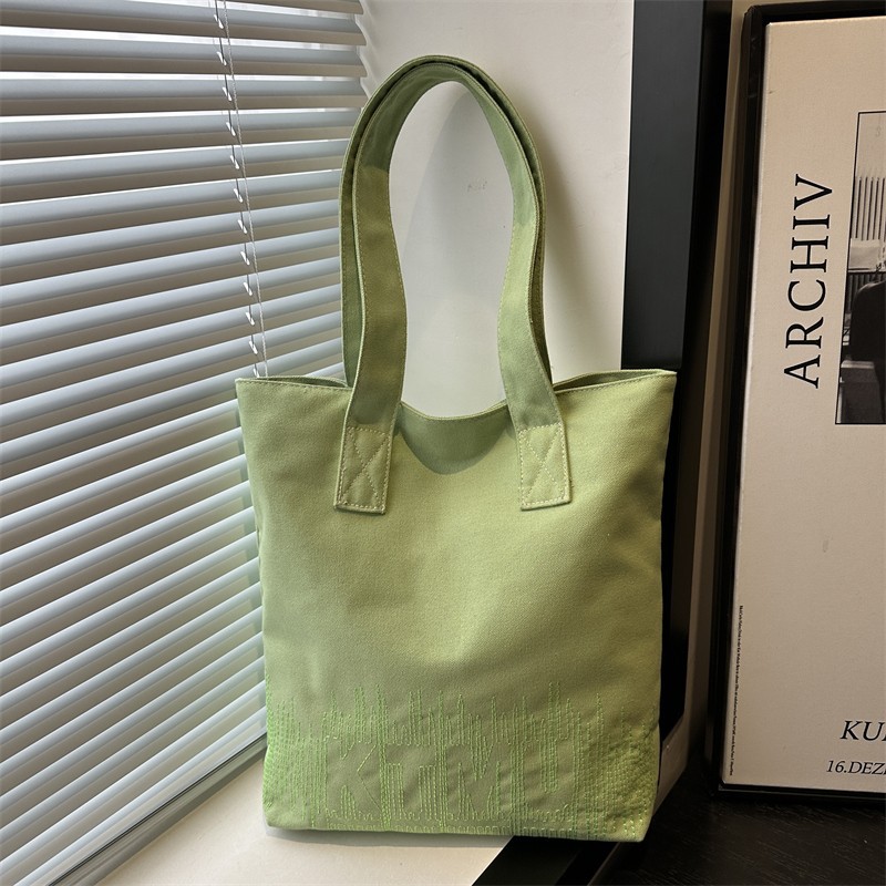 Fashionable and casual Korean-style embroidered canvas bag for women, 2024 new model student hand-held book bag for commuting, single-shoulder tote bag details Picture