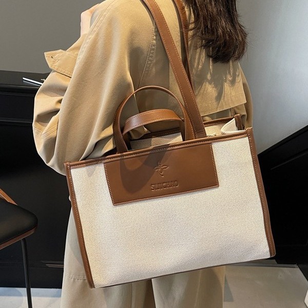 A new high-capacity, high-quality tote bag for women's casual work and commuting, a simple hand-held shoulder bag for autumn and winter full figure