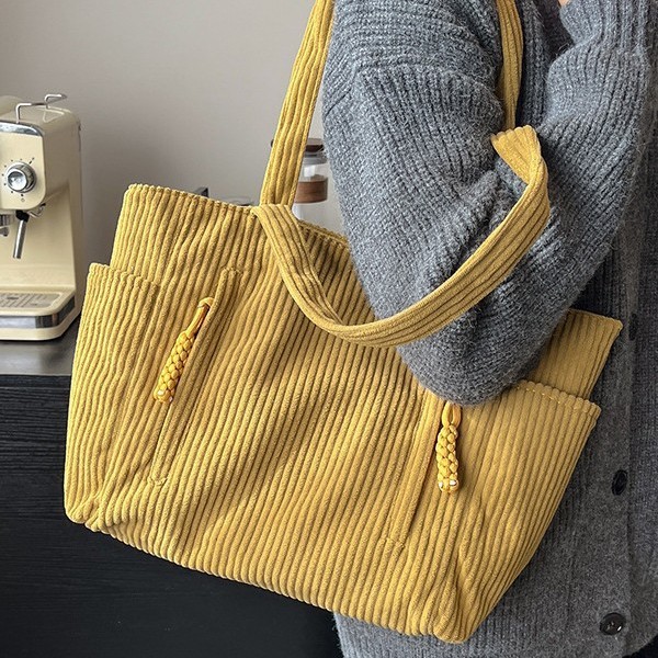 A popular 2024 autumn/winter new retro corduroy multi-pocket single-shoulder bag with large capacity, a student class bag made of fabric full figure