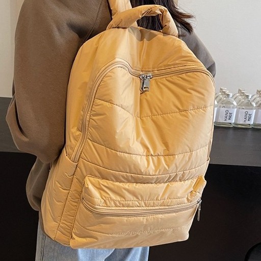 New large-capacity cotton jacket backpacks for autumn and winter, niche commuting travel bags, fashionable and versatile, personalized casual schoolbags Application Scenario