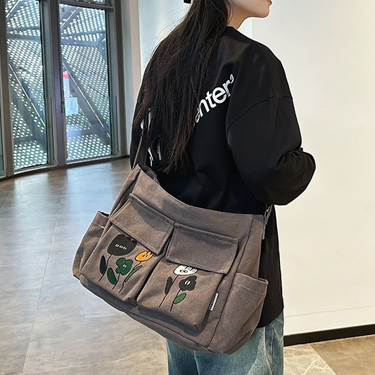 Canvas crossbody bag for women, large-capacity tote bag for college students' commuting to class, 2024 new style, casual and versatile single-shoulder bag full figure