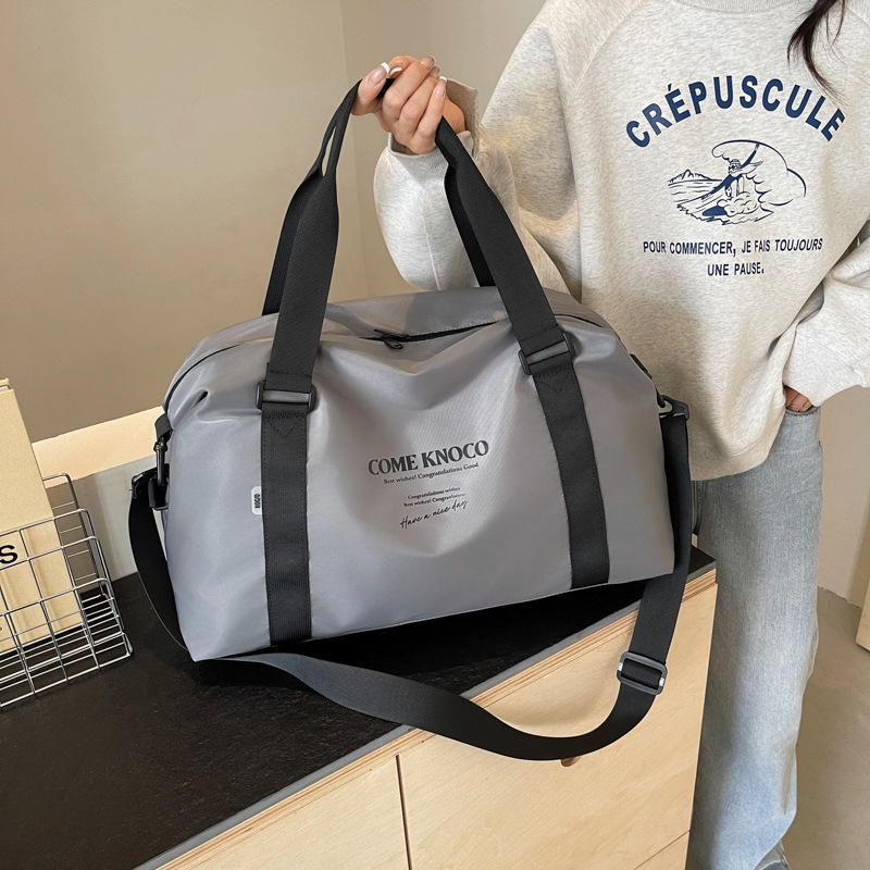 Wholesale of large-capacity fashionable travel bags, business trip boarding short-distance luggage storage bags, lightweight casual sports and fitness bags full figure