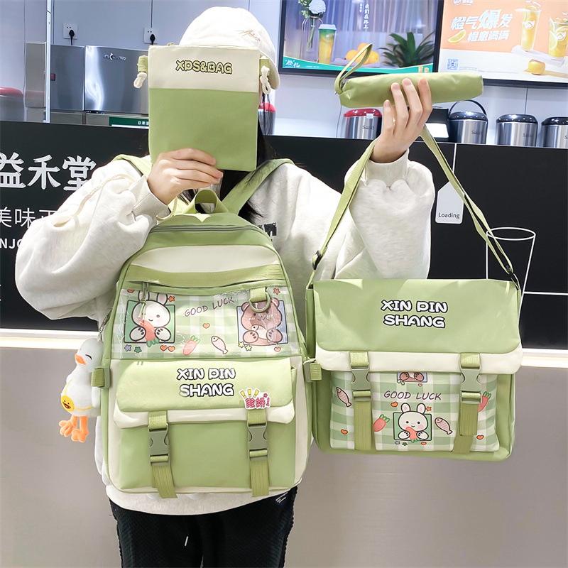 Wholesale of 4-piece sets of Korean checkered backpacks for girls, primary and middle school students, tutorial bags, and back-to-school season backpacks full figure