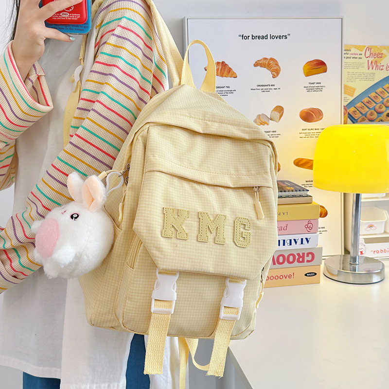 Soft and cute cream-yellow kindergarten children's travel backpack, high appearance level, ins sweet and girlish mini backpack full figure