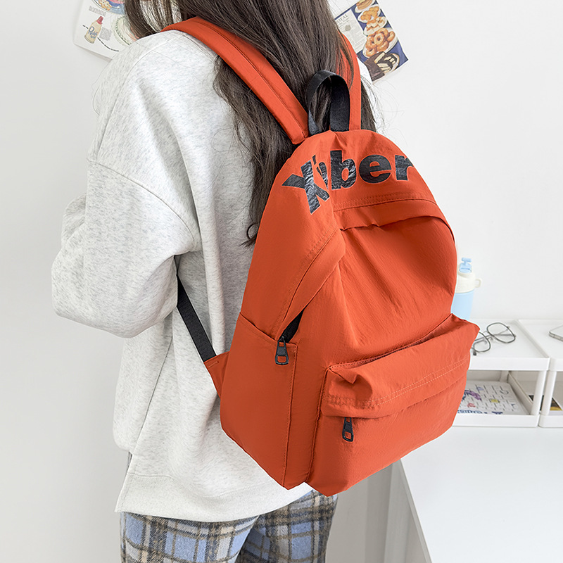 Simple men's and women's backpacks, sturdy and durable, large-capacity campus letter backpacks for junior high school students, and casual college student schoolbags Application Scenario