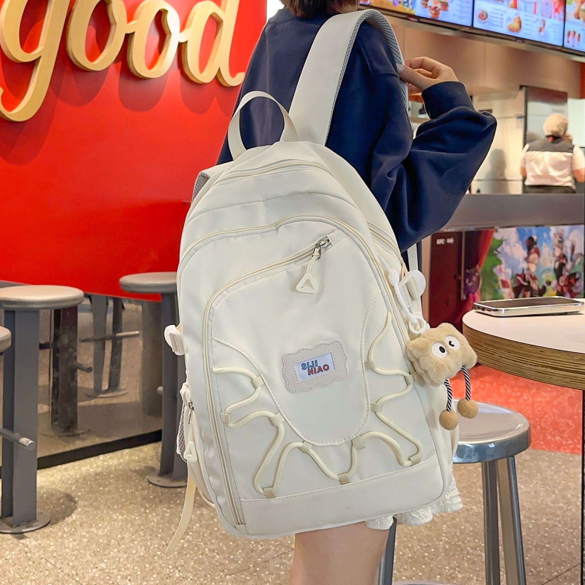 This high-appearance-level ins style large-capacity backpack is lightweight and has a niche design sense. It is a multi-layered backpack for junior and senior high school students full figure