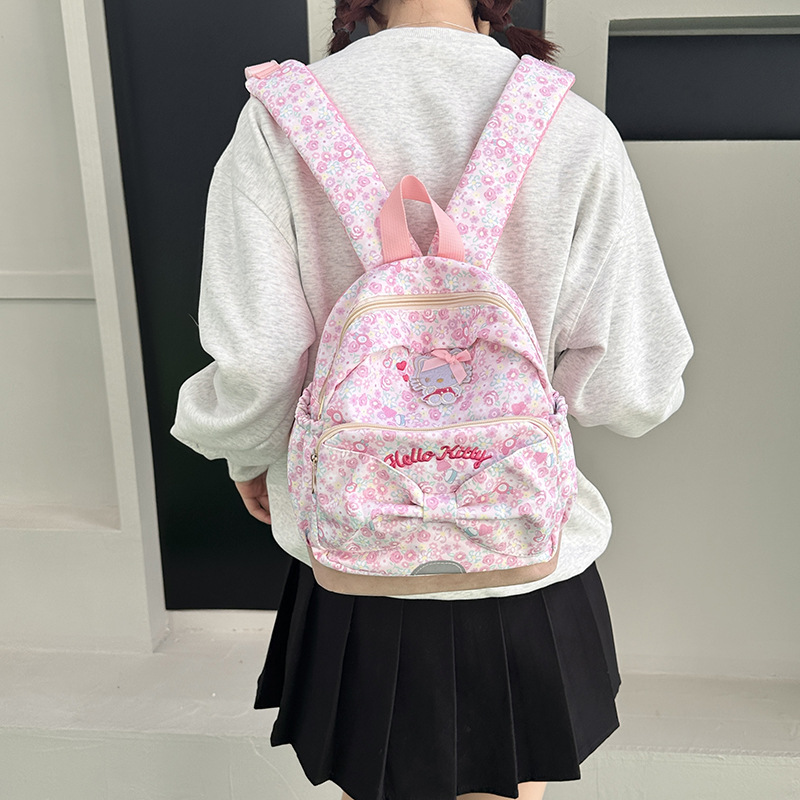 A sweet and cute large-capacity backpack with floral prints for cross-border girls. A cartoon backpack for junior high school and primary school students full figure