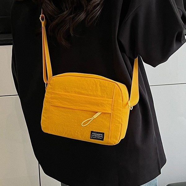 Japanese-style lightweight single-shoulder crossbody bag for women, ins versatile solid color casual bag, multi-pocket large capacity simple small backpack for women Application Scenario