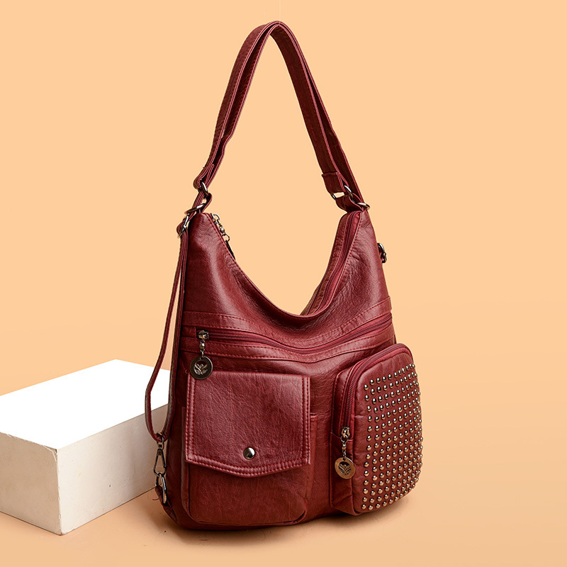 The new PU soft leather women's bag is versatile and fashionable. It's a multi-layered small bag with rivets and a casual single-shoulder crossbody bag details Picture