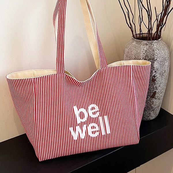 A new large-capacity tote double-sided striped casual single-shoulder textured lettered canvas bag for student commuting from South Korea Specification drawing