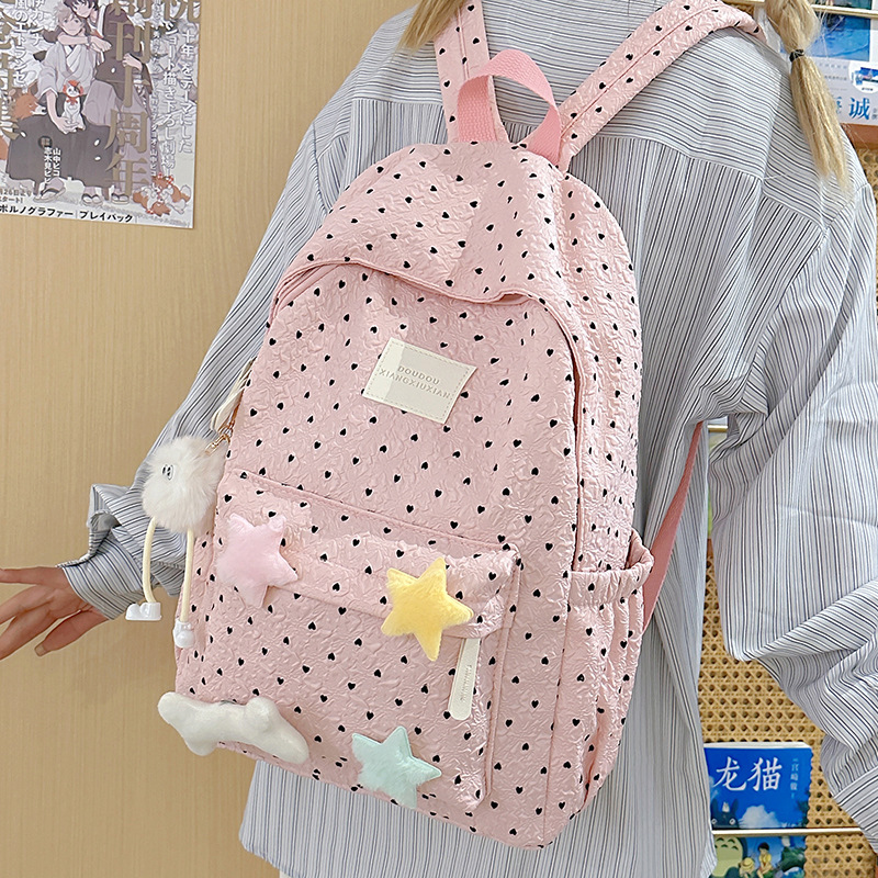 The fresh and cute schoolbag is a niche and adorable girl with floral prints. It has a large capacity and is versatile for high school and junior high school students. The college student backpack has a high level of appearance details Picture