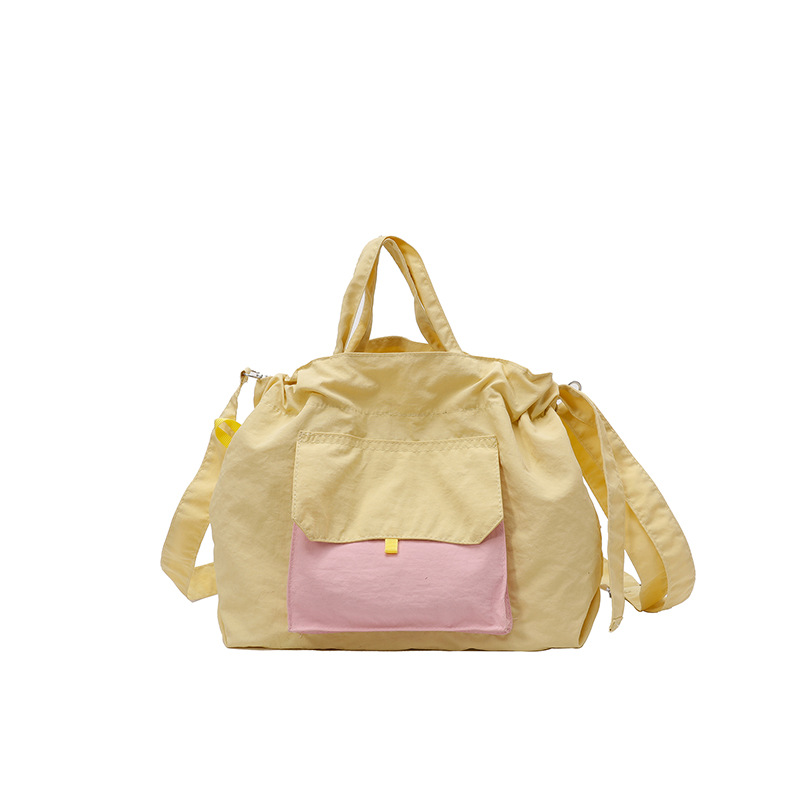 A new cross-border Korean niche artistic and simple nylon drawstring drawstring hand-held armpit bag, single-shoulder crossbody fabric bag Item Picture