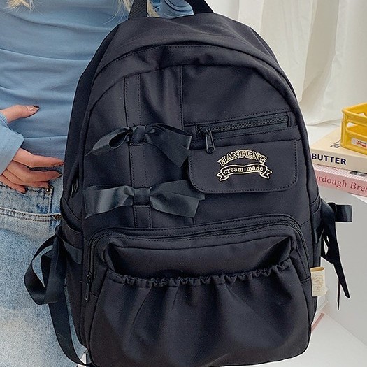 The new Japanese ins2024 backpack for girls with a high level of appearance, a bow backpack, and a cute cream-style backpack for students details Picture