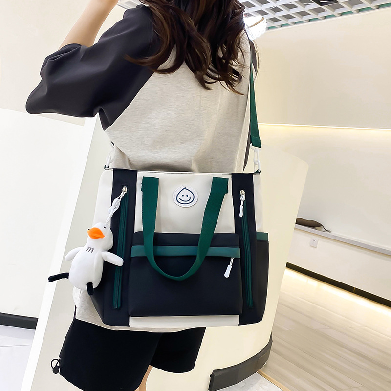 Color-blocking casual large-capacity tutorial bag, book bag for junior and senior high school students, hand-carried bag for class, high appearance level crossbody bag for girls Application Scenario