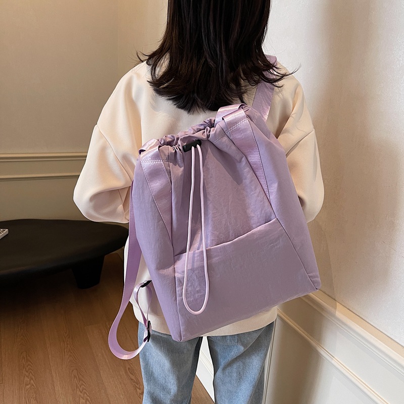 A new large-capacity, versatile Japanese solid-color, simple commuter backpack for women, multi-purpose drawstring handbag full figure