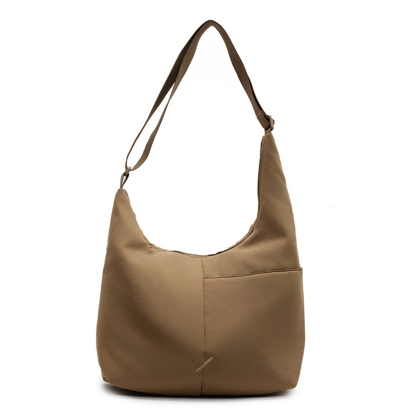 Work commuting canvas bag, laid-back style tote bag for women, new 2025 trendy and versatile underarm bag, large-capacity single-shoulder bag Item Picture