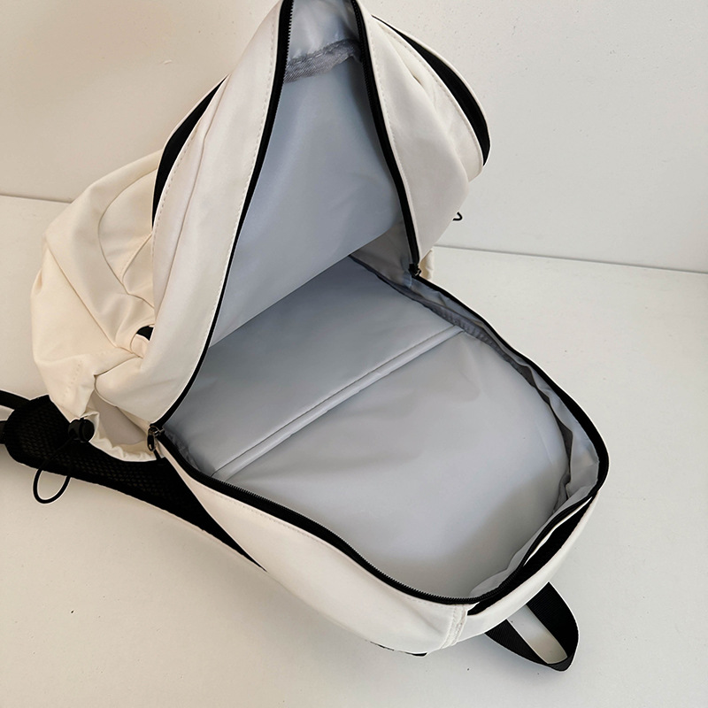 Large-capacity InS-style simple and versatile solid color schoolbag, light and portable couple backpack for junior high school, senior high school and college students' campus style Application Scenario