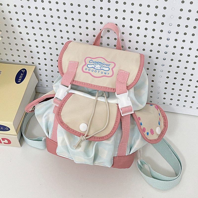 The new Korean donut big ear collaboration backpack, primary school schoolbag, girls' crossbody bag, and mini bag of cinnamon dog full figure
