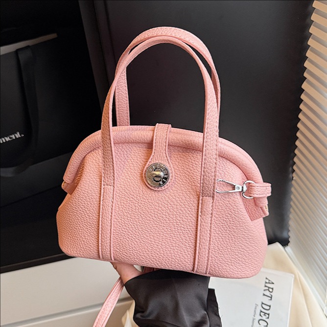 A new, trendy and fashionable single-shoulder crossbody bag for women in 2025, featuring a high-end, light luxury and niche hand-held shell bag full figure