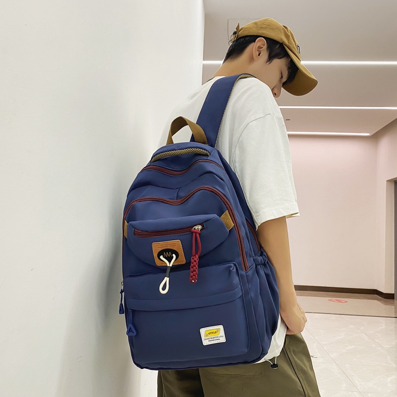Trendy brand backpacks for men in 2024, large-capacity travel backpacks for junior and senior high school students, and computer backpacks for female college students details Picture