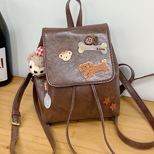 Cute cartoon bone dog backpack, a new retro casual and fashionable backpack for girls' commuting details Picture