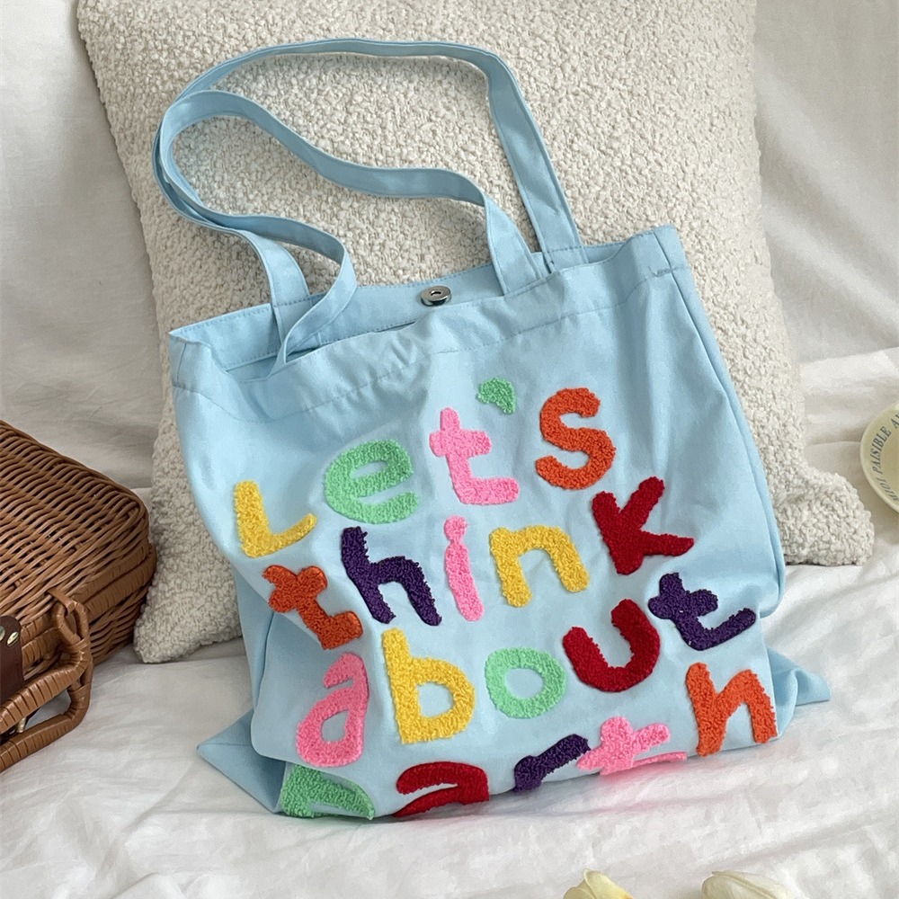 4651 Korean-style colorful lettered laid-back artistic canvas bag, versatile for commuting, large-capacity student shoulder bag Application Scenario