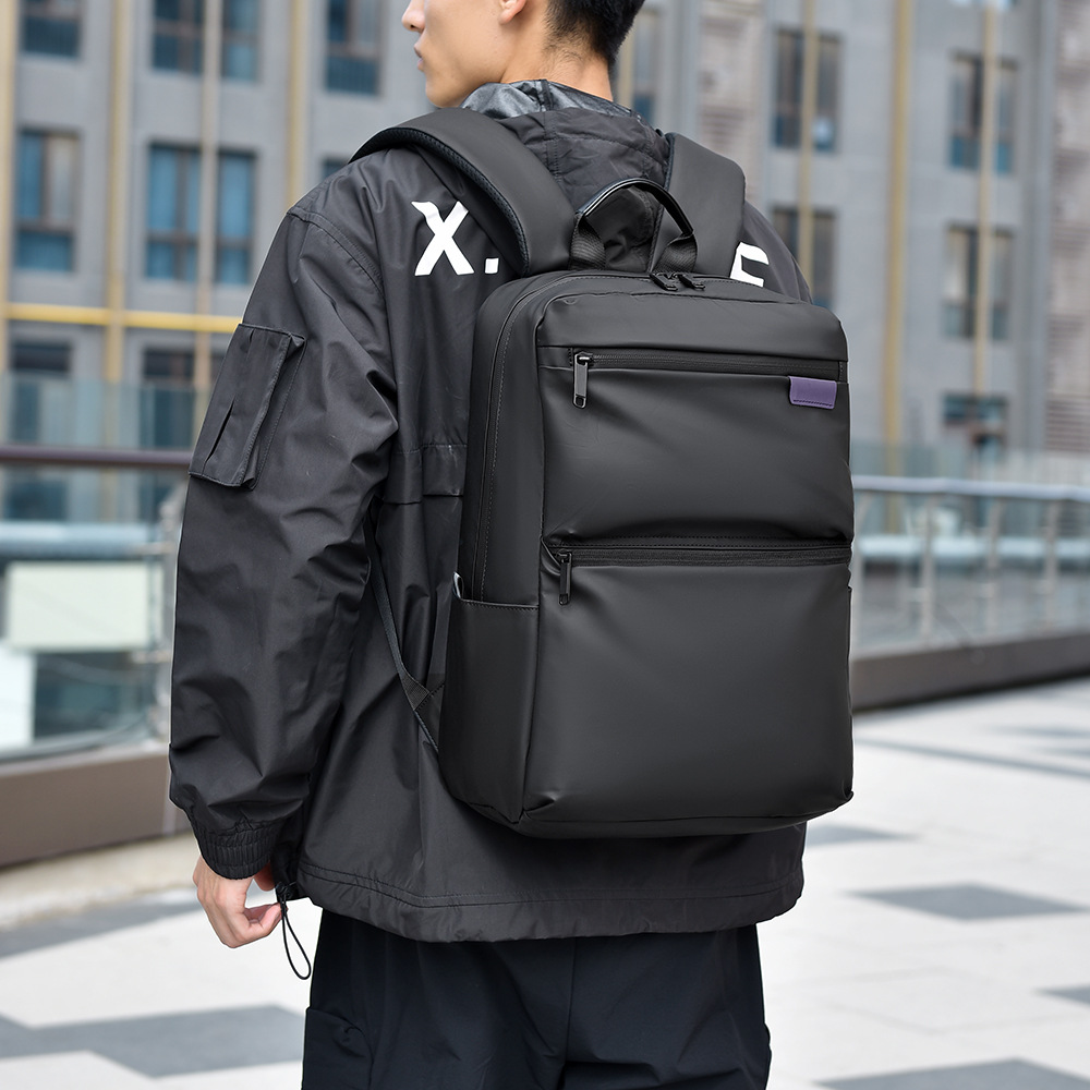 The new cross-border backpack has a large capacity and can hold simple and trendy men's travel bags, college student schoolbags and computer bags full figure