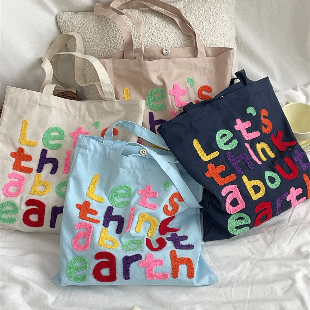 4651 Korean-style colorful lettered laid-back artistic canvas bag, versatile for commuting, large-capacity student shoulder bag full figure