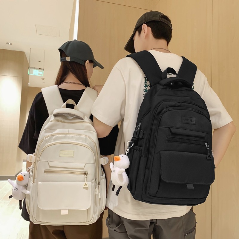 High-appearation-level, simple and casual couple travel backpack, large-capacity, multi-compartment backpack for junior and senior high school students, male full figure