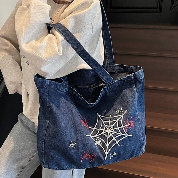 A versatile Instagram Korean denim tote bag for women 2025, featuring a large capacity single-shoulder bag with embroidered design for commuting details Picture